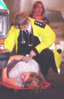 A distressed fan is attended by a member of St. John’s Ambulance