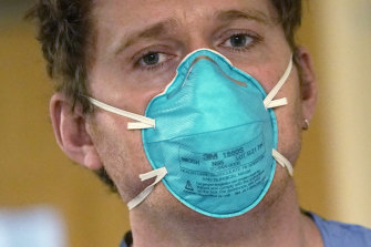 A registered nurse wears an N95 mask.