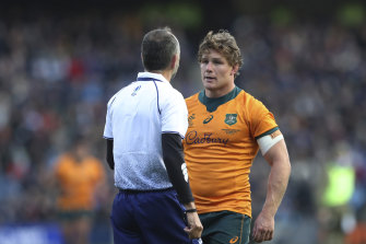 Eye to eye: Michael Hooper and French referee Romain Poite talk during Australiaâs loss to Scotland. 