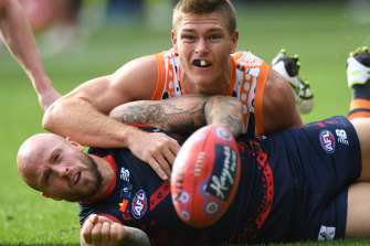 Former Giant Adam Tomlinson clashes with soon-to-be Demons teammate Nathan Jones. 