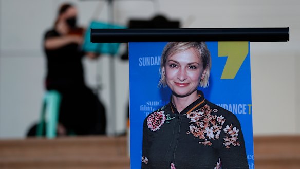 A musician plays a violin behind a photograph of cinematographer Halyna Hutchins during a vigil in her honour in Albuquerque, New Mexico. 