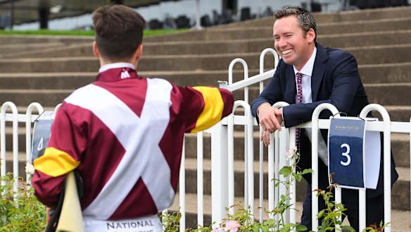 Adam Hyeronimus offers trainer Adrian Bott his elbow.
