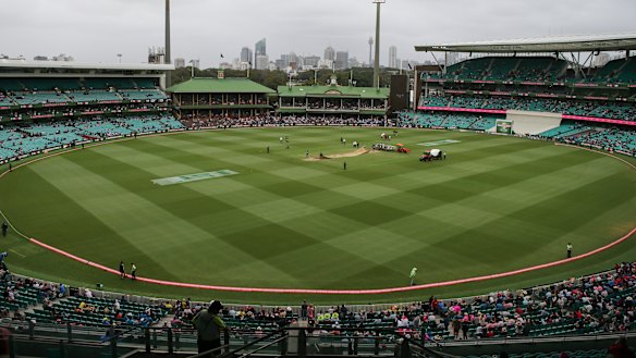 The scene as umpires ponder the light at the SCG.