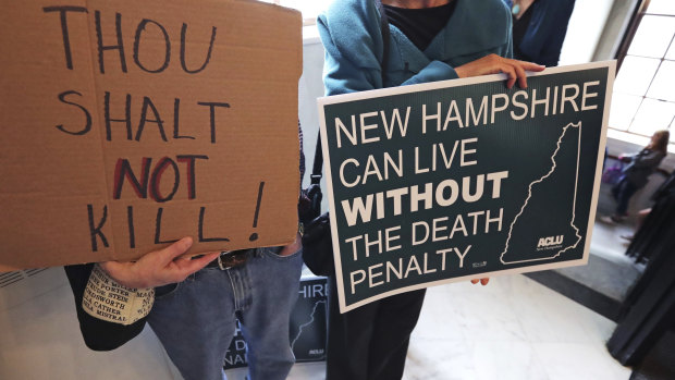 Protestors make their case ahead of the vote in New Hampshire. which has become the latest state to abolish the death penalty.