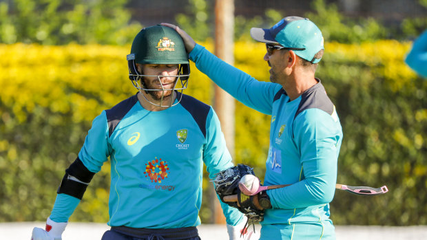 Langer (right) is thrilled to have David Warner and Steve Smith back in the fold.