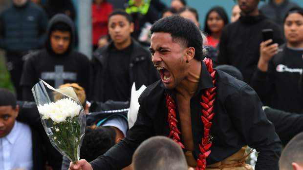 Victoria University Secondary College school captain Poasa Telepe performs the haka during a memorial for Solomone Taufeulngaki outside Brimbank Shopping Centre on Friday evening.