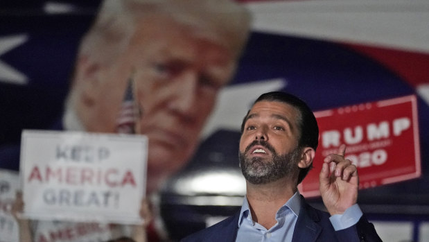 Donald Trump jnr, gestures during a news conference at Georgia Republican Party headquarters.
