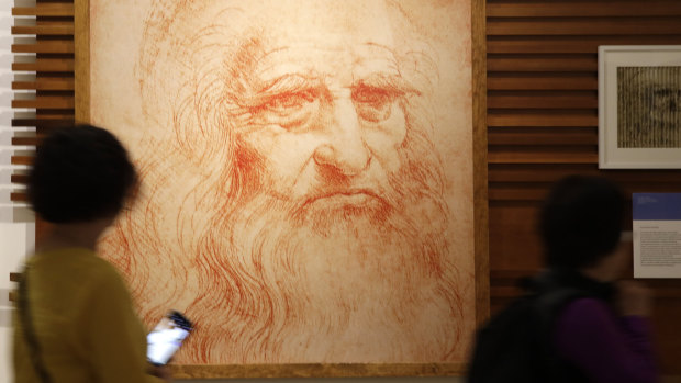 Visitors pass a portrait of Leonardo da Vinci in Rome on the 500th anniversary of his death.