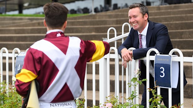 Adam Hyeronimus offers trainer Adrian Bott his elbow.
