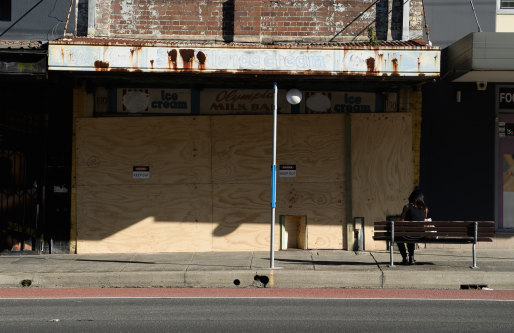 Boarded up: the old Olympia milk bar on Parramatta Road at Stanmore.