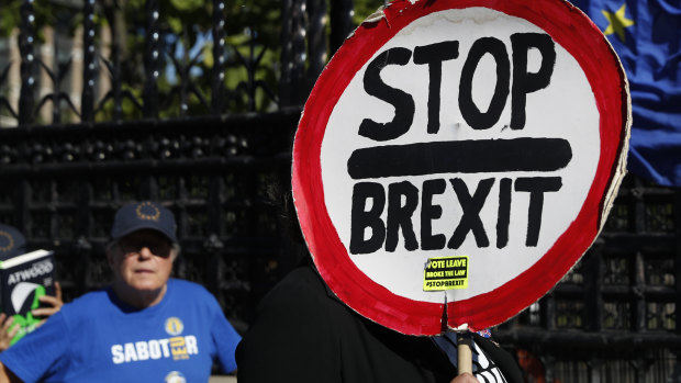 Anti-Brexit protesters demonstrate outside the Houses of Parliament in London.