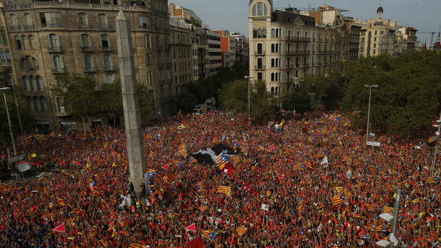 Pro-Independence demonstrators pack the Avenida Diagonal during the Catalan National Day in Barcelona, Spain.