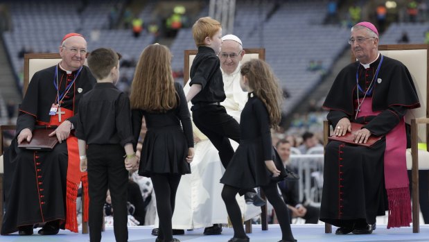 Pope Francis watches dancing children at the Festival of Families in Croke Park Stadium in Dublin, Ireland, on Saturday.