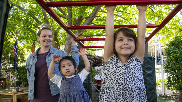 Kaitlin Gonzalez, a university student and childcare worker, with children at a Sydney long daycare centre.