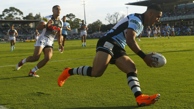 Super finish: Valentine Holmes crosses for the Sharks at Southern Cross Group Stadium.