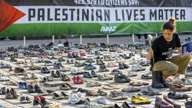 4500 pairs of shoes are laid out in front of the European Parliament in Brussels, each pair representing a life lost in the Palestinian conflict in the past decade.