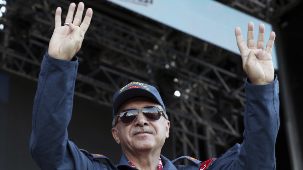 Turkey's President Recep Tayyip Erdogan waves as he attends the Teknofest aviation, space and technology fair at the new airport in Istanbul on Saturday.