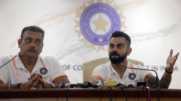 Indian captain Virat Kohli (right) and head coach Ravi Shastri address the media ahead of the trip to Australia.