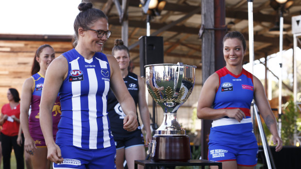 Ellie Blackburn (right) and former teammate Emma Kearney share a joke at the AFLW launch on Wednesday.