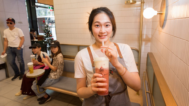Cheese tea is tipped as one the food trends of 2019. Pictured, Gotcha Tea staffer Nadia with a strawberry macchiato cheese tea. 