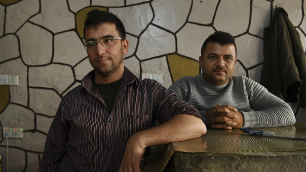 Brothers Raman*,35 (left), and Aram*, 31 in their kebab shop in Basirma refugee camp in Iraqi Kurdistan.