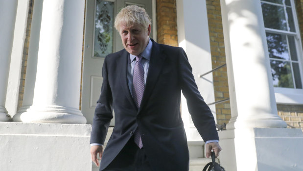 Boris Johnson leaves his home on Tuesday.
