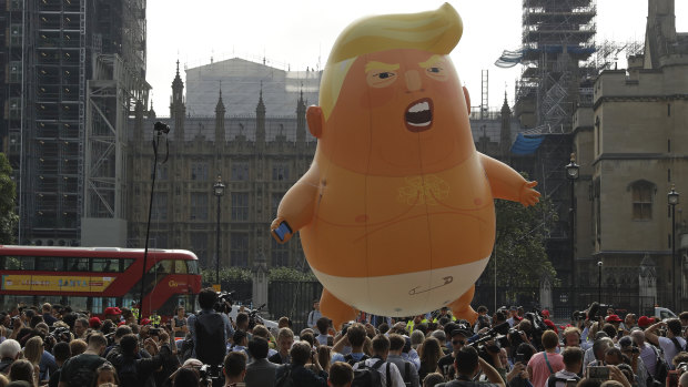 A six-metre high baby blimp of Donald Trump hovers over a London  protest in July.