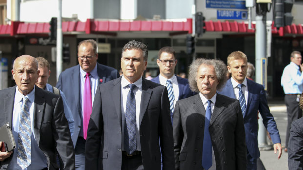 Dreamworld CEO Craig Davidson (centre) arrives with lawyers to the pre-inquest hearing in April into the fatal accident at the Dreamworld theme park.