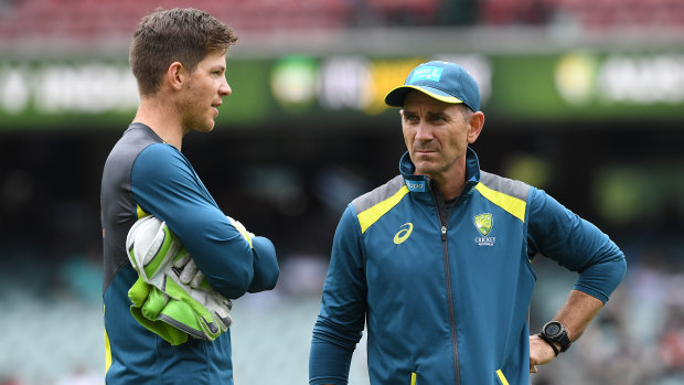 Tim Paine speaks with Justin Langer ahead of play on day three of the first Test match between Australia and India. 