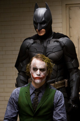 Heath Ledger, front,  as the Joker, in a scene with Christian Bale as Batman in The Dark Knight.