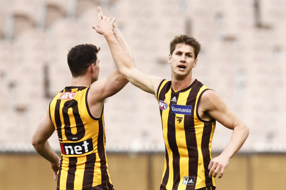 Daniel Howe (right) has re-signed with the Hawks.