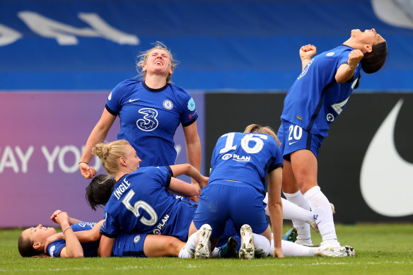 Millie Bright and Sam Kerr celebrate with Fran Kirby after Chelsea’s late goal.