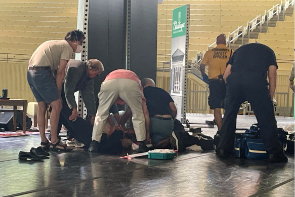 Author Salman Rushdie is tended to after being attacked during a lecture at the Chautauqua Institution.