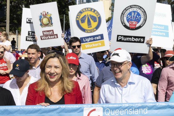 Labor leader Anthony Albanese, right, with Queensland Premier Annastacia Palaszczuk at a labour day march in Brisbane, told workers they deserved a government that would lift wages.