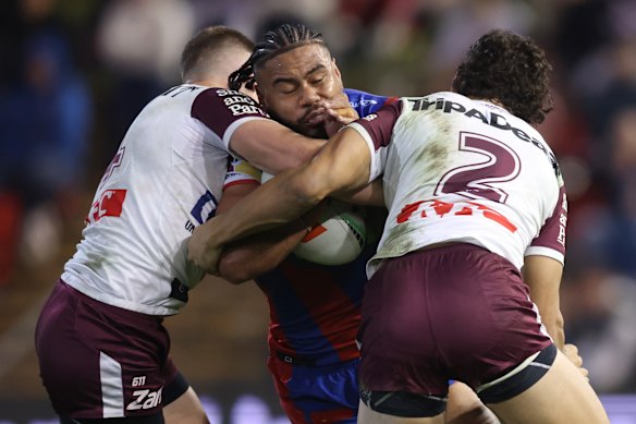 Greg Marzhew takes on the Manly defence.