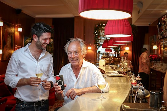 Le Splendide bar manager Jimmy Pluet with co-owner Jean-Paul Prunetti at the bar which requires patrons to put a sticker over their mobile phone camera. 
