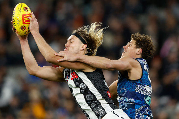 Clunk: Darcy Moore plucks another one against Carlton on Sunday.