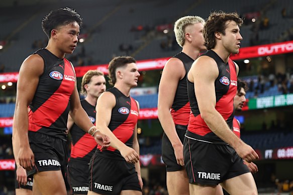 Andrew McGrath leads his team off the MCG after their horror loss to the Hawks.