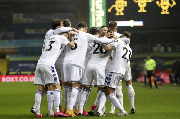 Leeds players celebrate their goal. Their draw with City leaves them in fifth spot.