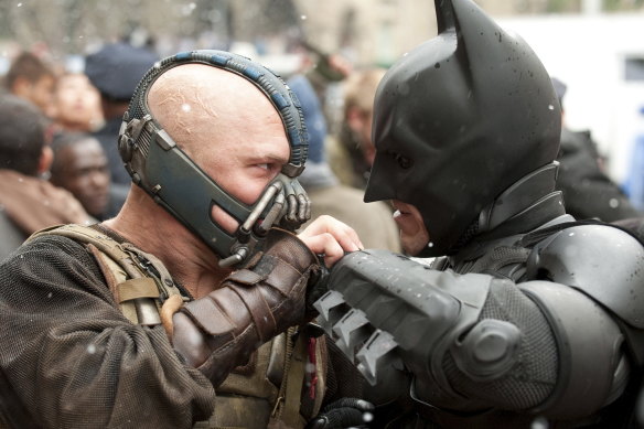 Tom Hardy's Bane faces off with Christian Bale's Batman in The Dark Knight Rises.