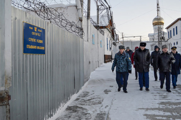 Russian officials walk inside the prison in Kharp, about 1900 kilometres north-east of Moscow, this month.