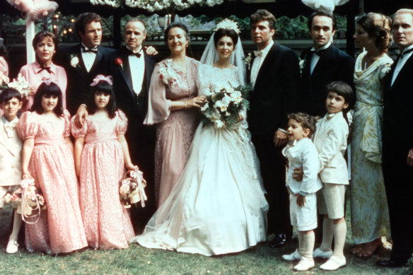 The Corleone family gathers for a wedding in the opening scenes of The Godfather. 