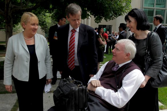 John Walsh (bottom right) in 2011, then Associate Commissioner of the Productivity Commission, with ministers in the then-Labor government, Jenny Macklin and Bill Shorten.