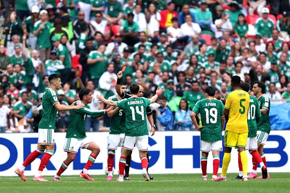 Cesar Montes is given a red card by referee Wilton Sampaio.