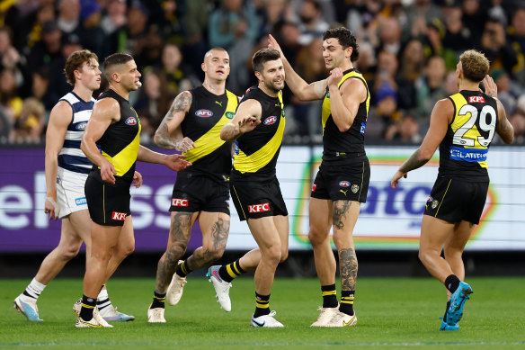 Trent Cotchin of the Tigers celebrates a goal with teammates.