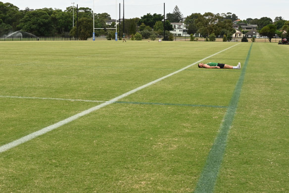 Rabbitohs hooker Damien Cook shows the width difference between a regular NRL field and the Las Vegas one.