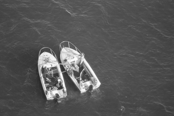 An aerial search for illegal abalone fishing discovers these two boats near Mallacoota in 1977.