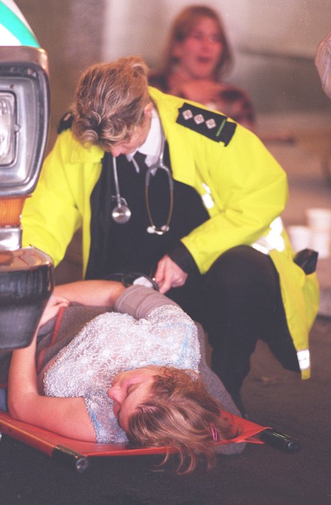 A distressed fan is attended by a member of St. John’s Ambulance