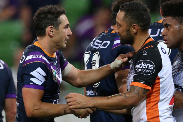 Veterans: Storm's Billy Slater shakes hands with Benji Marshall of the Tigers.
