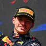 Race winner Max Verstappen of the Netherlands celebrates on the podium. 